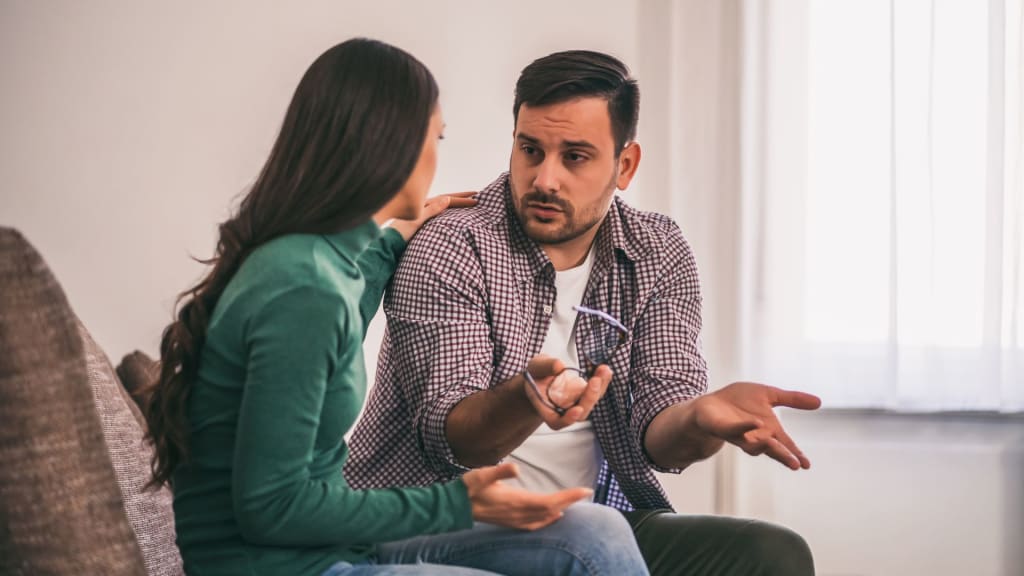 Couple talking at home